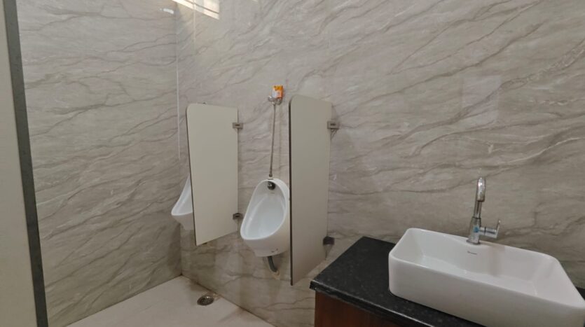 Men’s washroom with urinal facility in office space